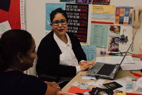 Two women sitting at desk