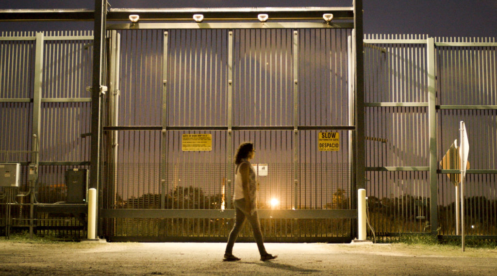 Rossy Lima at the U.S.-Mexico border wall in Brownsville, Texas.