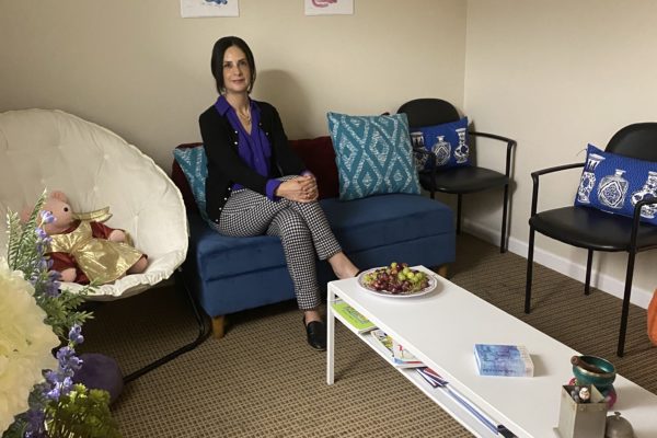 Dr. Anabel Plasencia smiles in her office where she meets Canal Alliance clients individually and in group lessons.