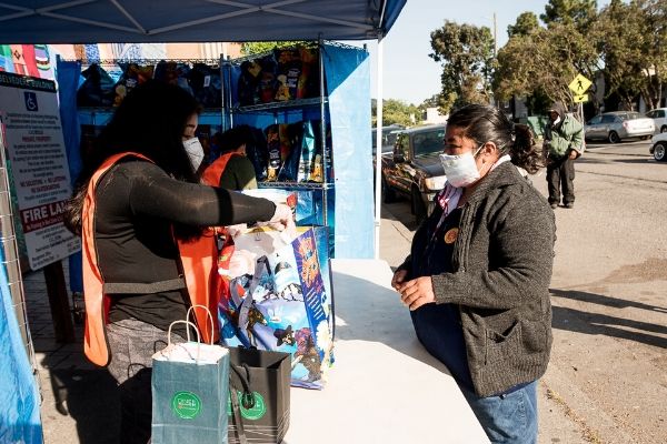 Woman standing in line at the Canal Alliance food pantry