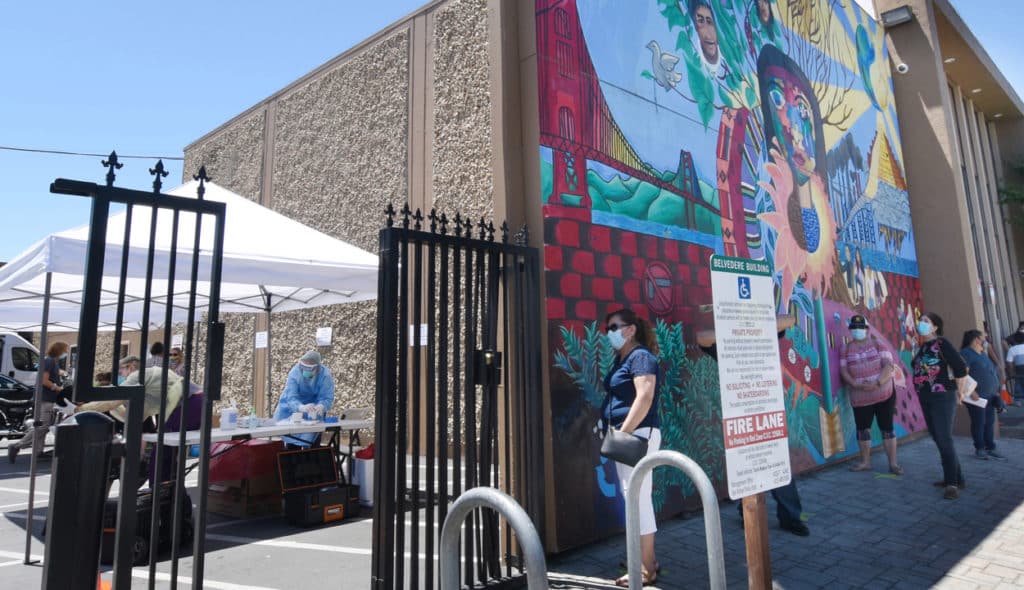 People wait in line for free coronavirus testing at Canal Alliance in San Rafael, Calif., on Wednesday, May 27, 2020. (Sherry LaVars/Marin Independent Journal)