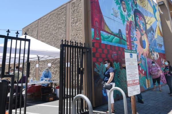 People wait in line for free coronavirus testing at Canal Alliance in San Rafael, Calif., on Wednesday, May 27, 2020. (Sherry LaVars/Marin Independent Journal)