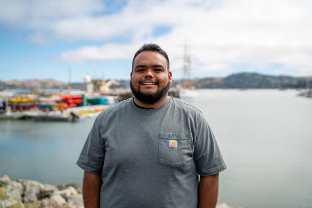 Jordan Vasquez stands in front of the Bay in Sausalito.