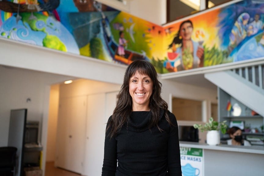 Krystal Sandza poses in the Canal Alliance office lobby.