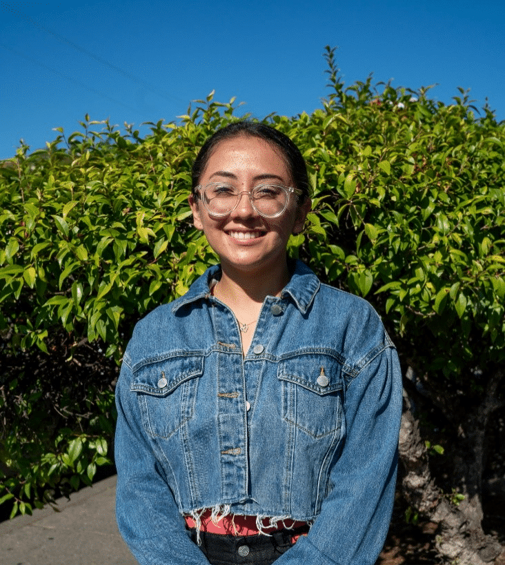 Britney Guitierrez Calderon standing in front of nature in the Canal. 