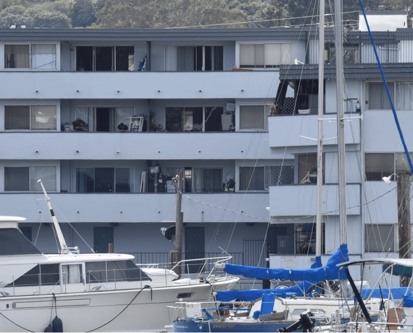 The Canal 400 building in front of boats. 